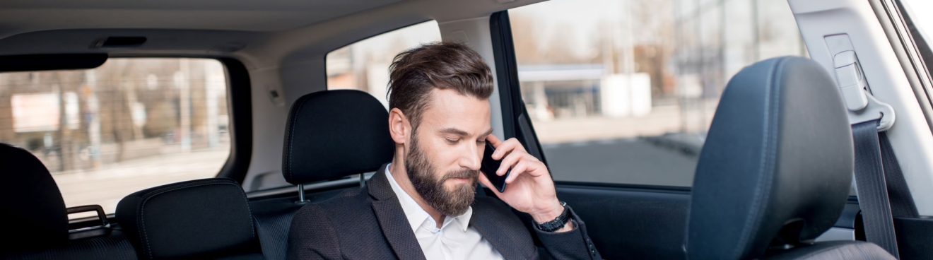 Man on Phone in Black SUV