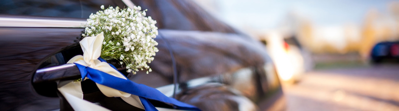 Black Luxury car with Wedding Bouquet on Door Handle